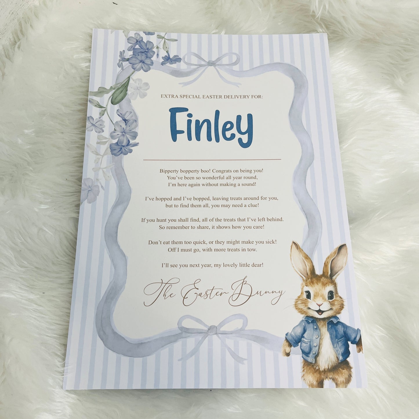 Blue Easter-themed card with a bunny illustration on a striped background and personalised with a name