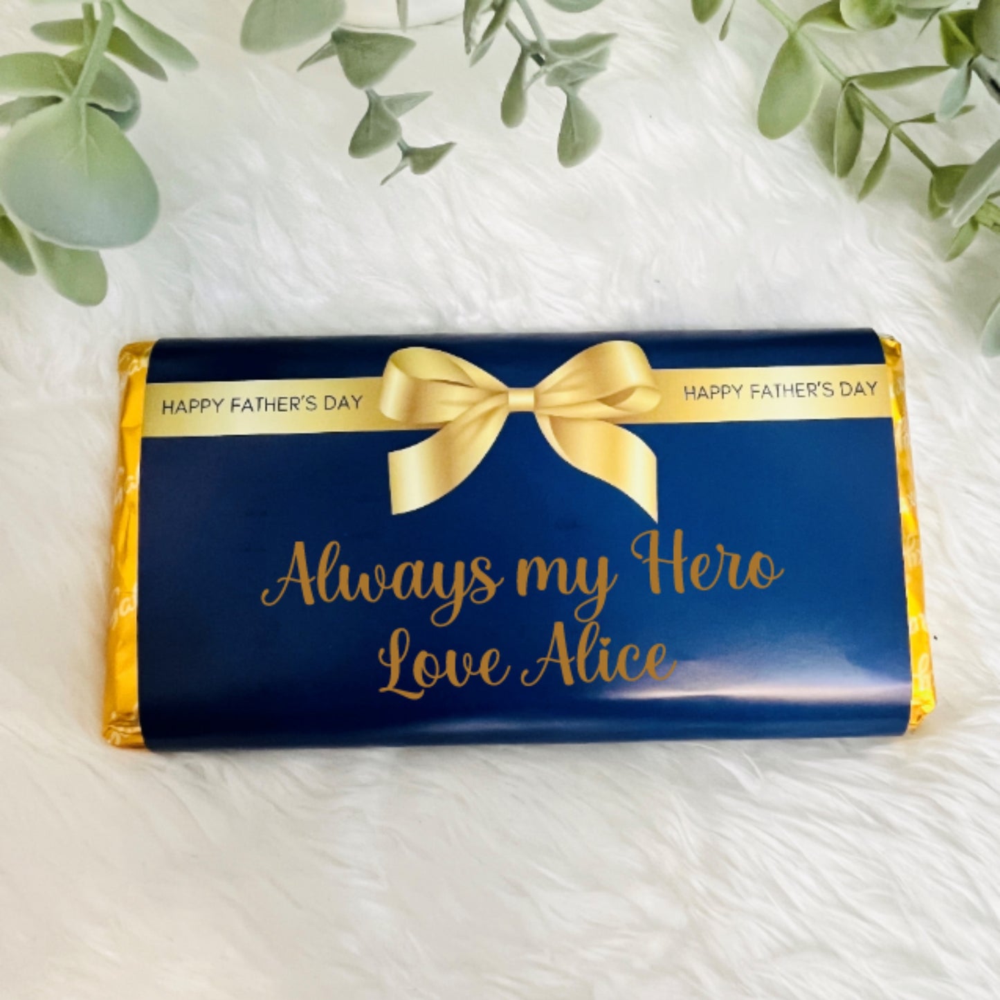 A navy and gold chocolate wrapper for fathers day with the text 'from your favourite child'