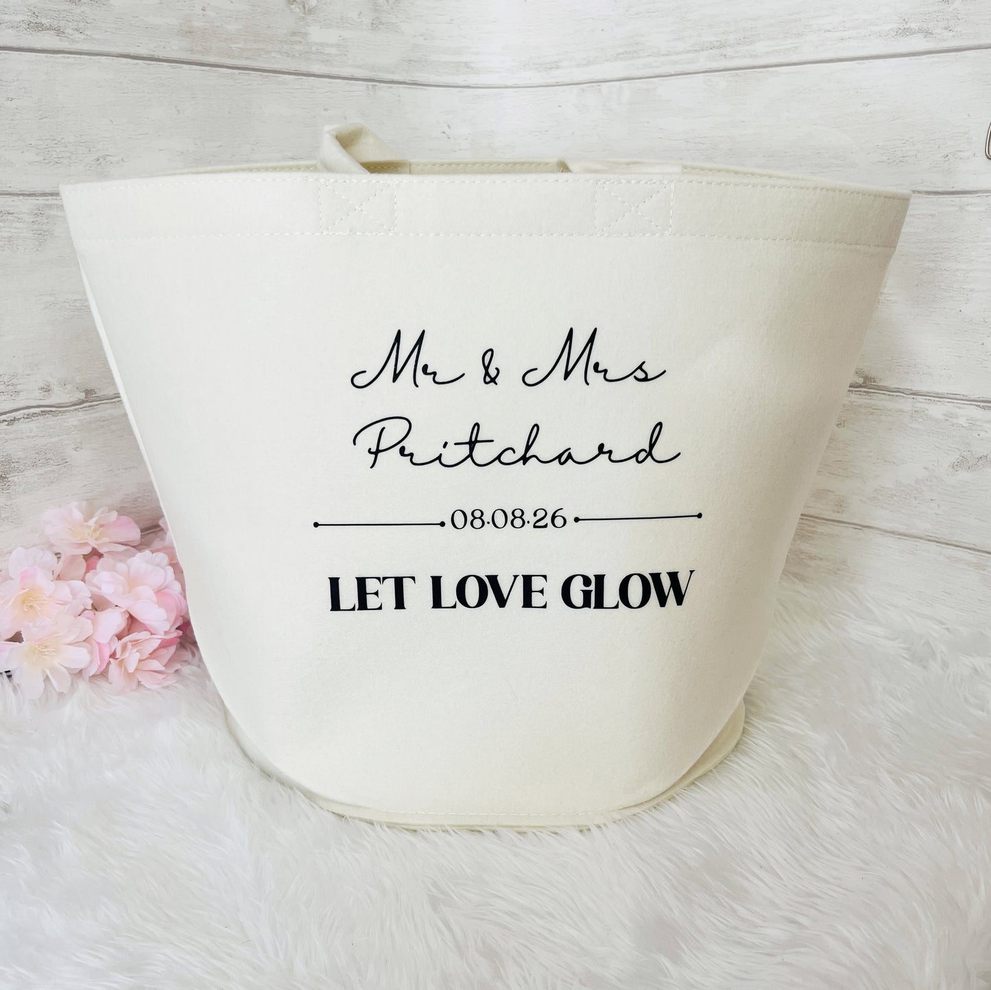 An off-white felt bag with black printed text reading 'Mr & Mrs Pritchard', and date '08.08.26