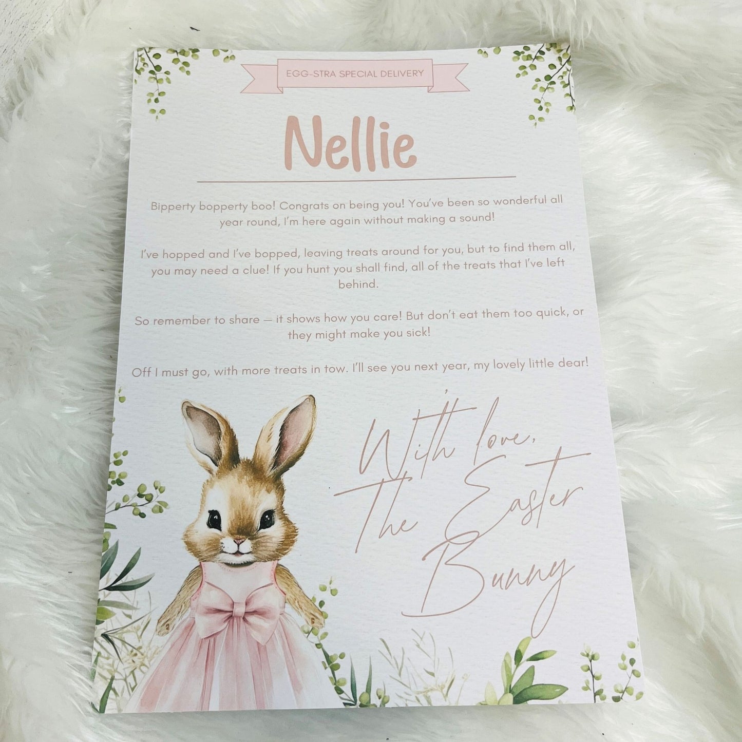 Letter from the Easter Bunny addressed to 'Nellie' on a white fluffy surface