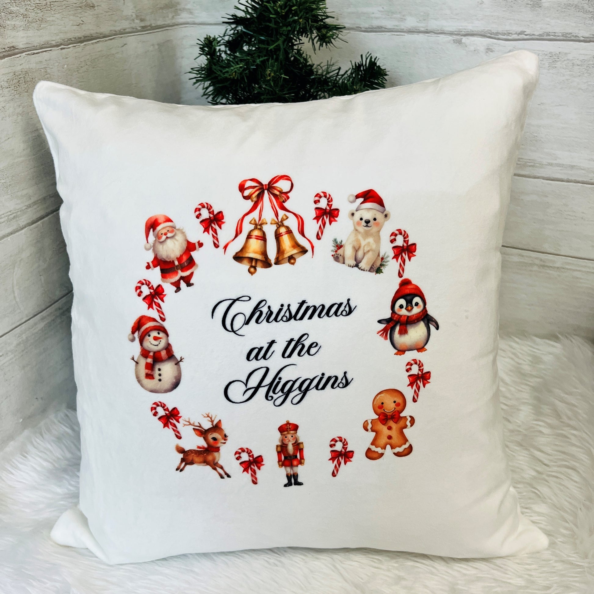 Decorative pillow with Christmas-themed illustrations and 'Christmas at the Higgins' text.