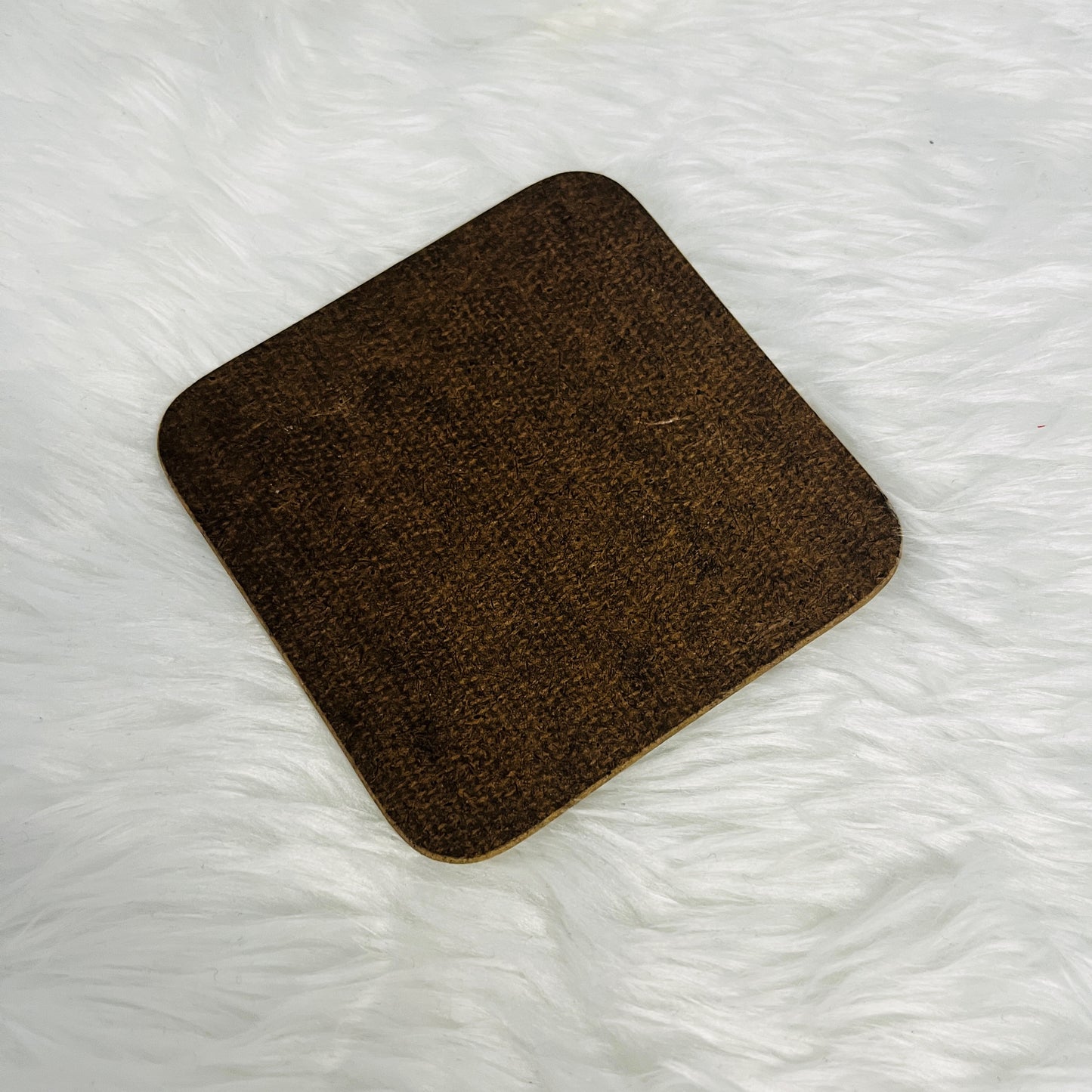 Image of the back of a cork square coaster