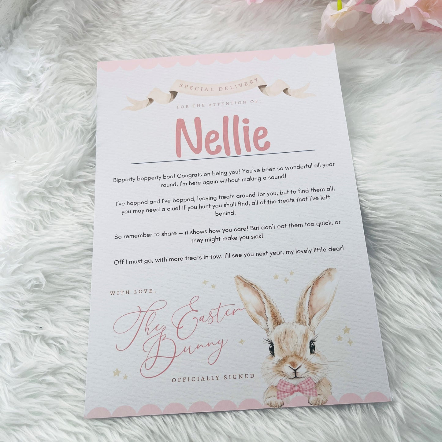 Letter from the Easter Bunny addressed to 'Nellie' on a fluffy white surface