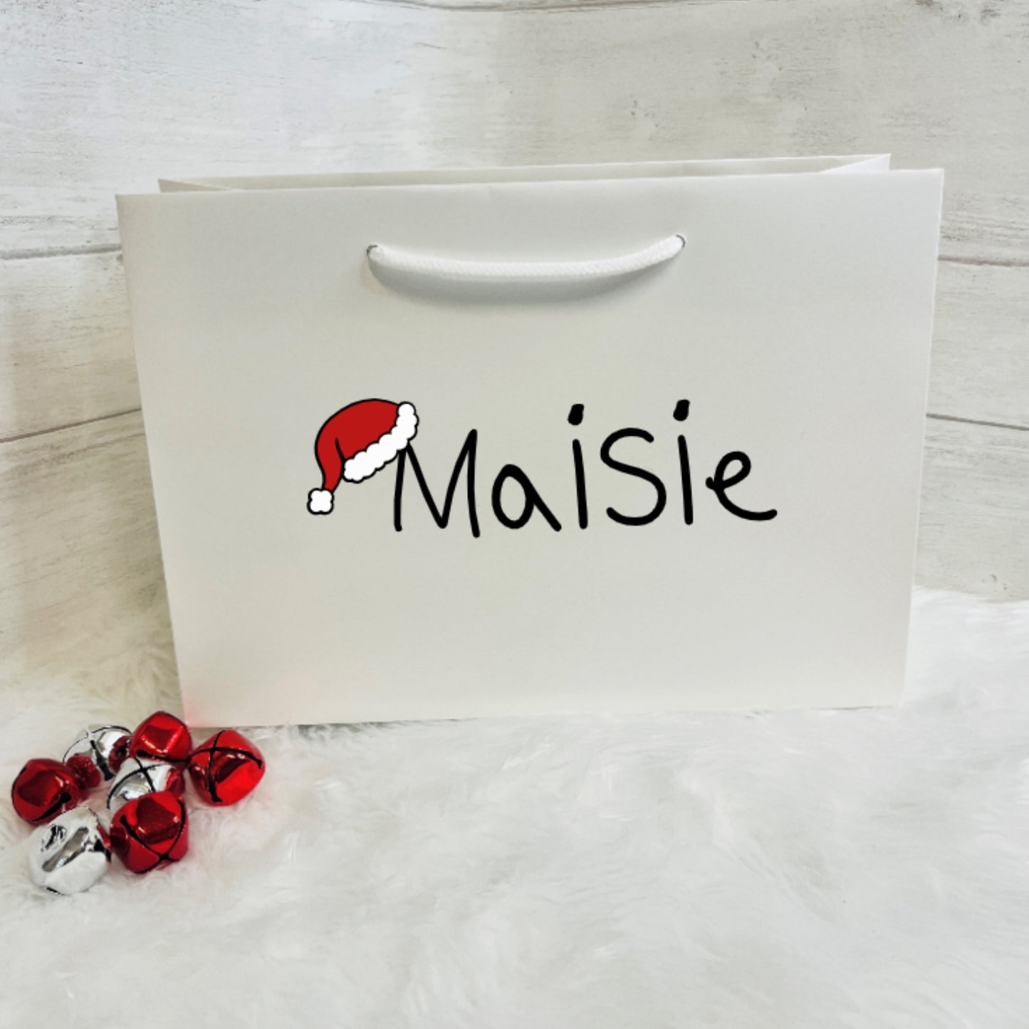 Large White christmas Gift Bag with a personaliserd name in Black Text and a Santa Hat image