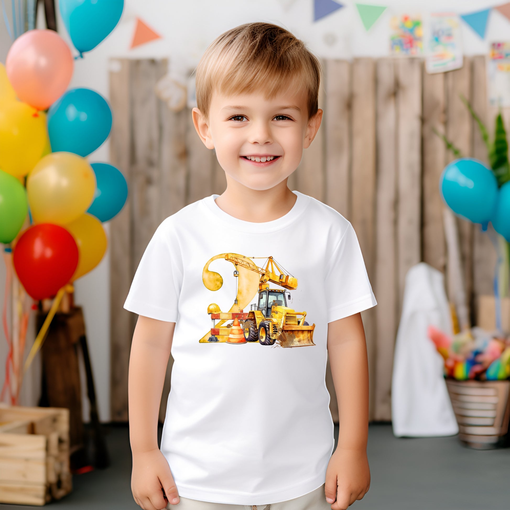 A child wearing a white 
T-shirt with a digger image and the number 2 on the front 