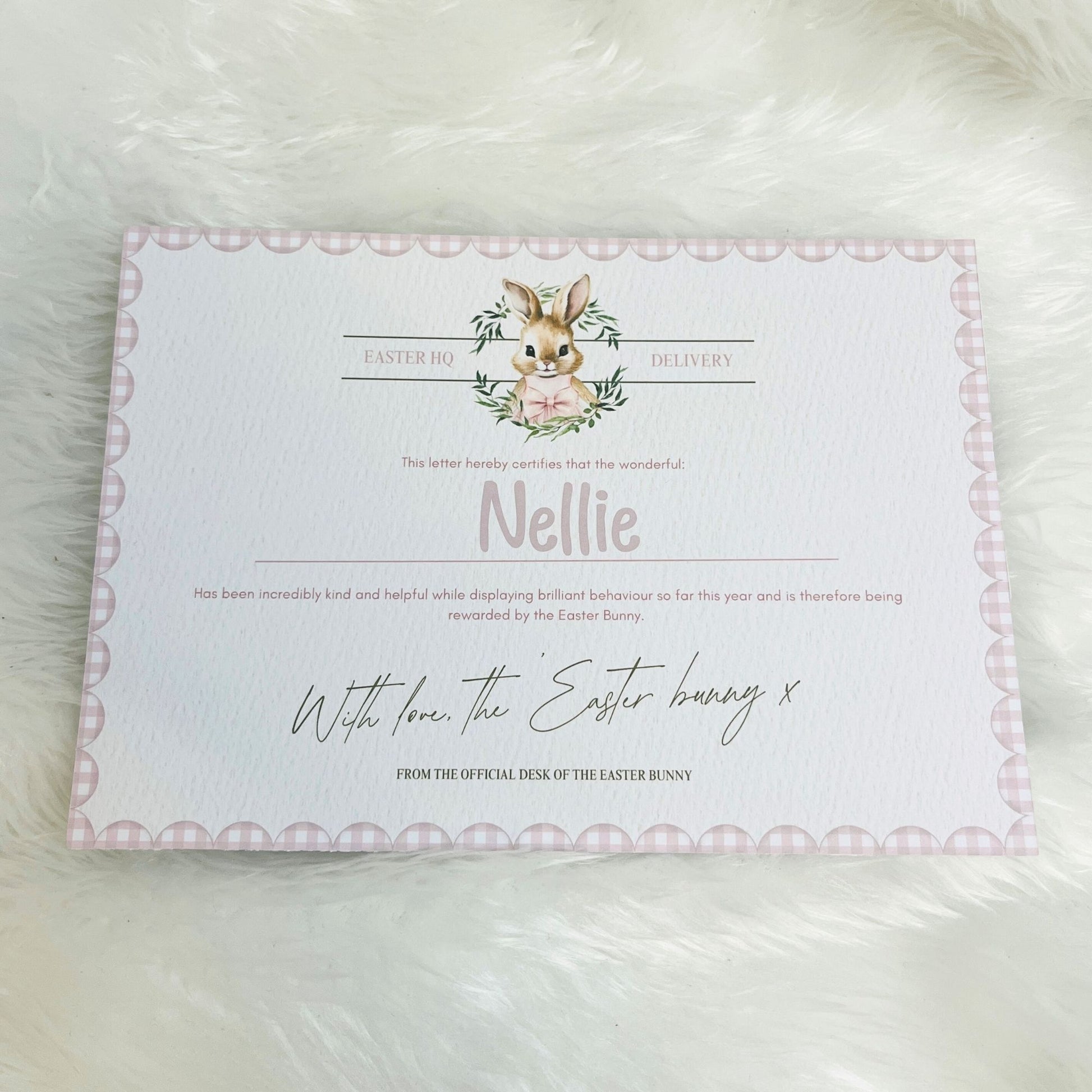 Letter from the Easter Bunny with decorative border on a fluffy white surface