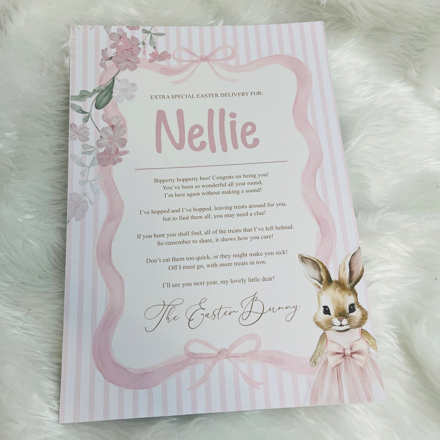 Pink Letter from the Easter Bunny addressed to 'Nellie' on a striped background