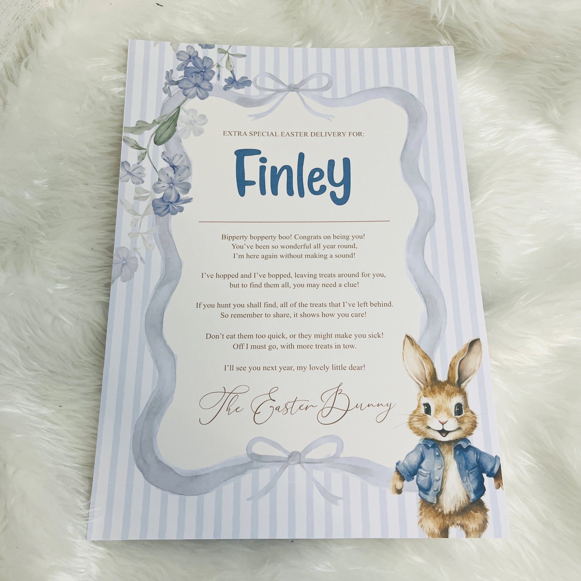 Blue Easter-themed card with a bunny illustration on a striped background and personalised with a name