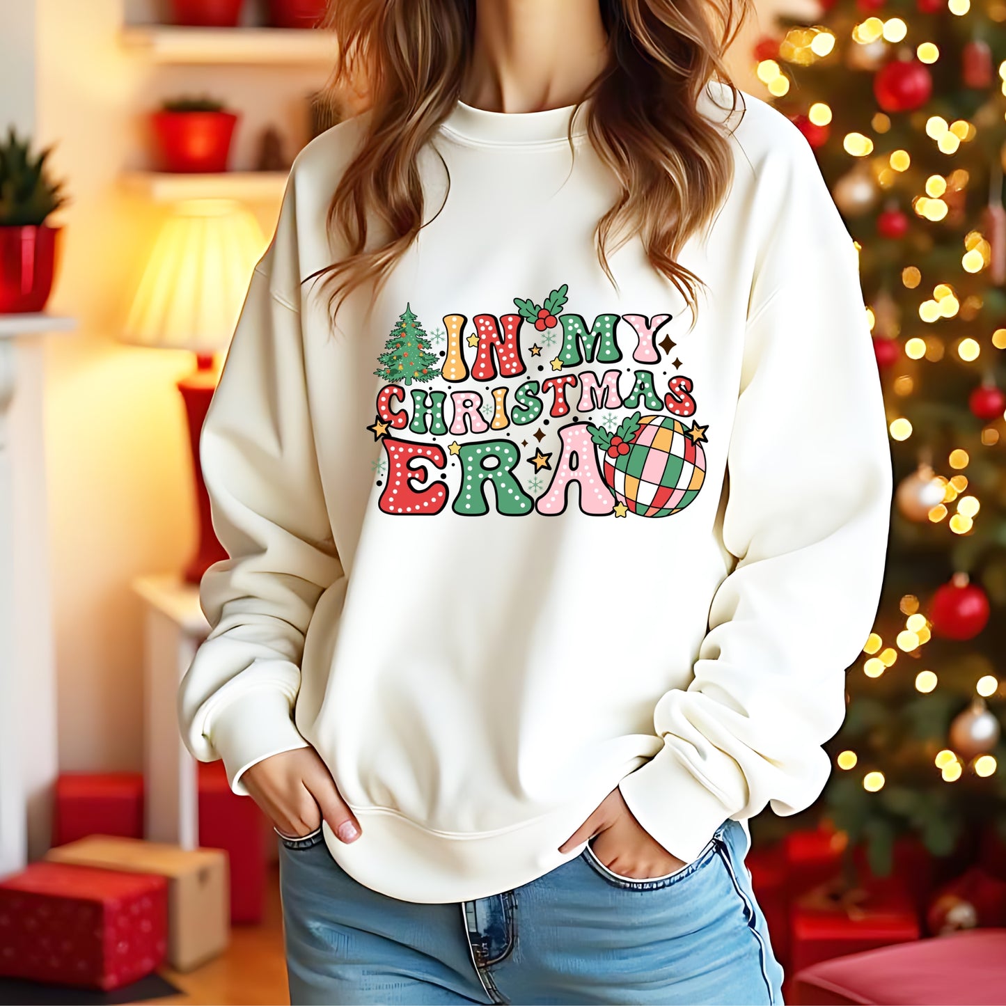 A model wearing a white jumper with 'In My christmas era' on the front in a bright colourful design
