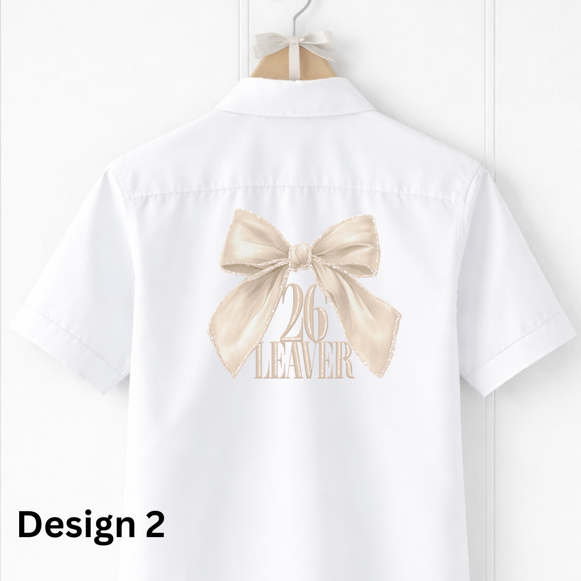 White shirt with a beige bow and '26 Leaver' text on a hanger against a white background