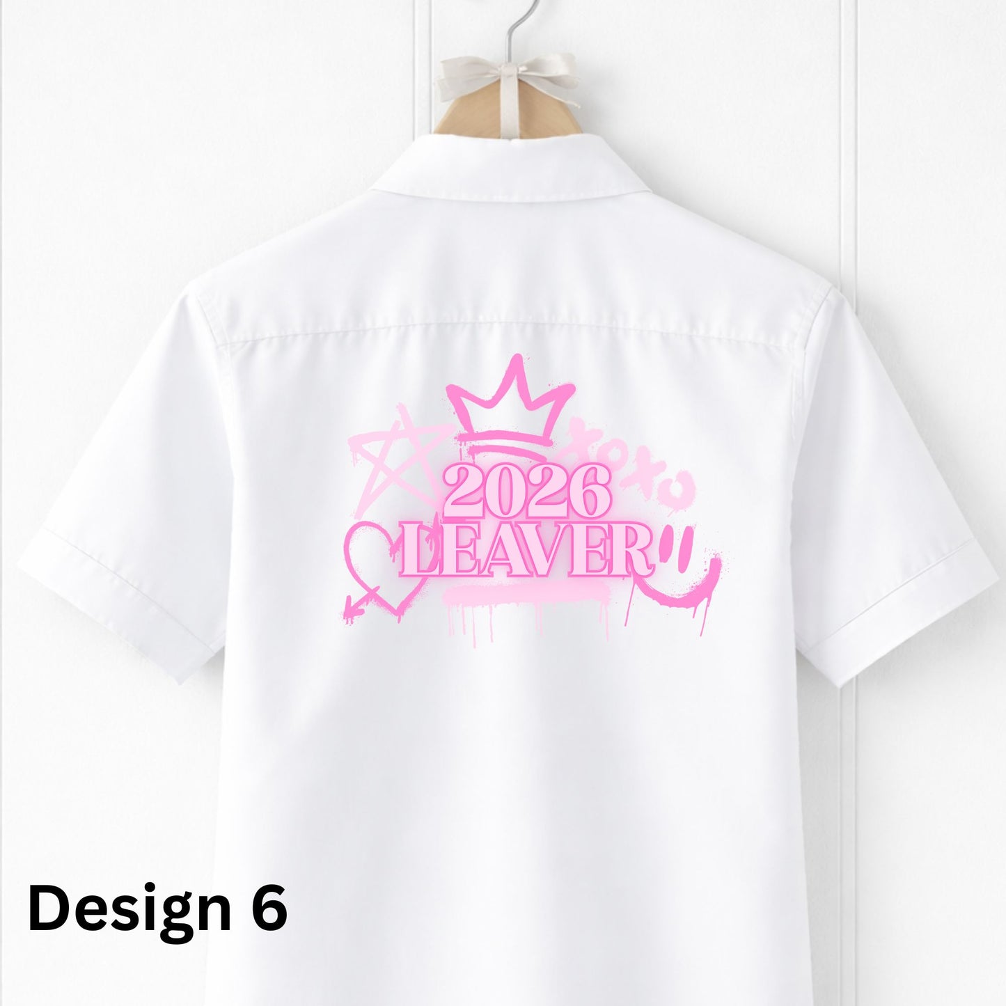 White shirt with pink '2026 Leaver' design on a hanger against a white background
