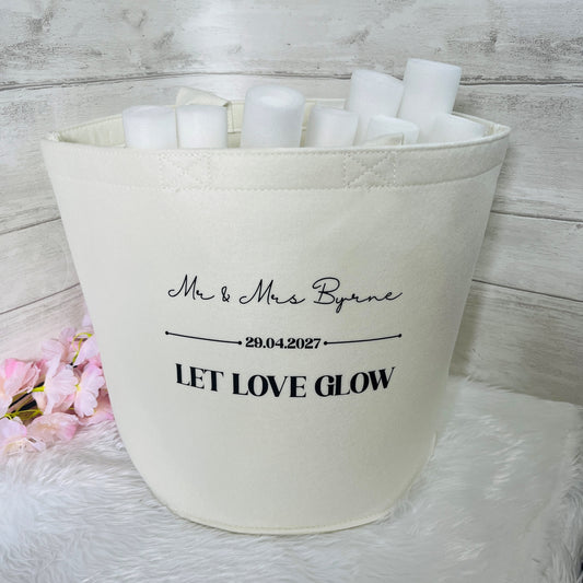 Cream Felt bag with personalized text and personalised glow sticks on a white background