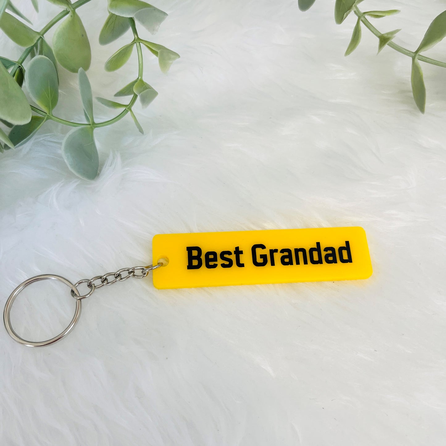 Black and yellow number plate keyring with the text Best Grandad