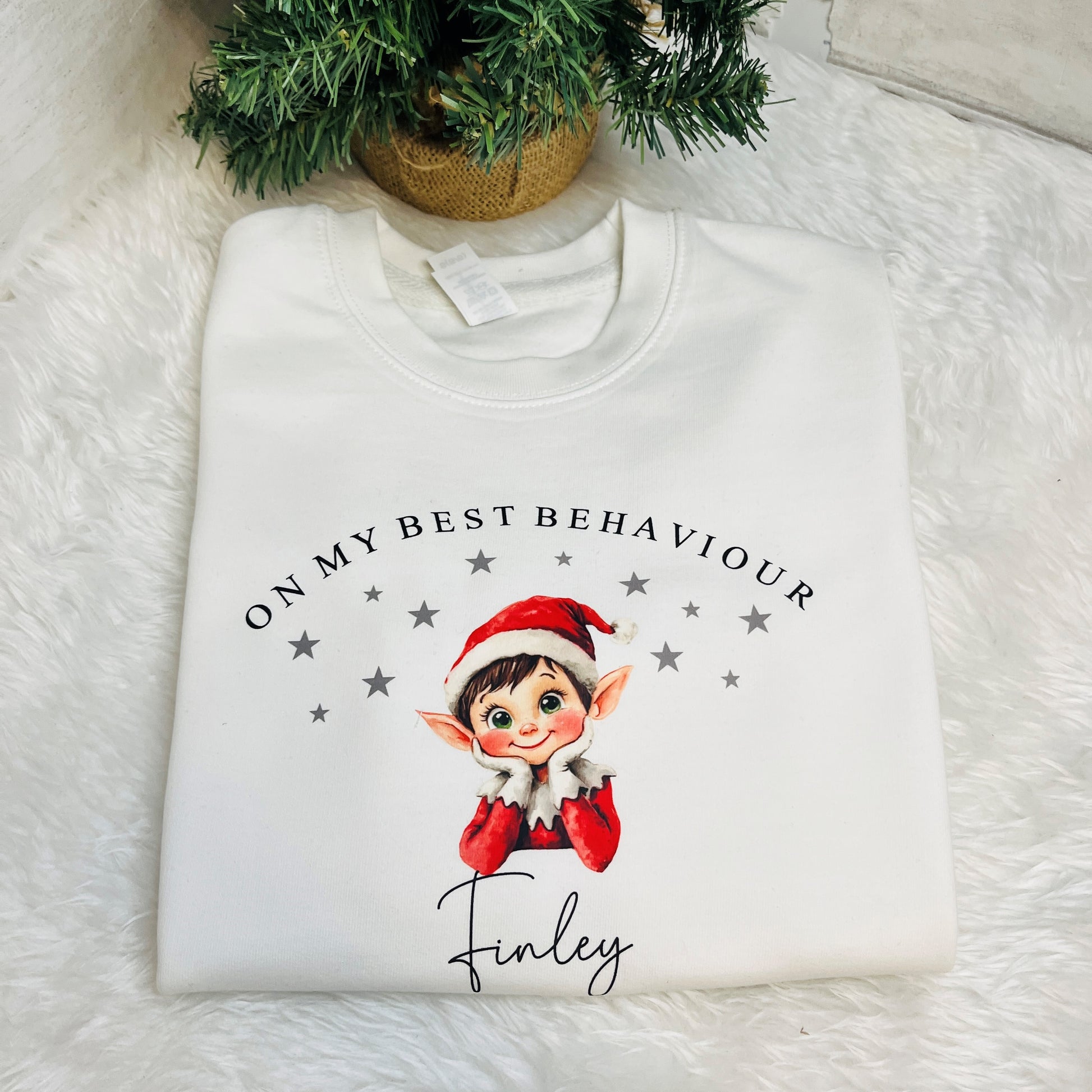 Kids Elf Jumper in white with a Christmas elf design and name