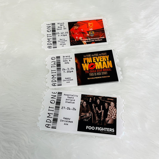 Three concert tickets with images and text on a white background