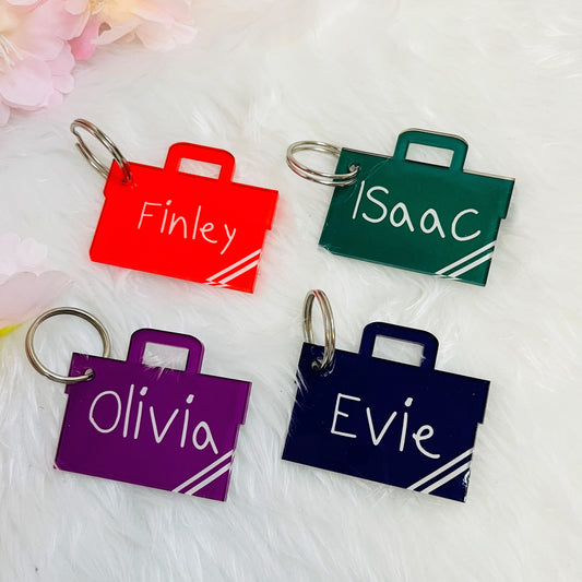 Personalised kids book bag keyring with child’s name in glossy acrylic