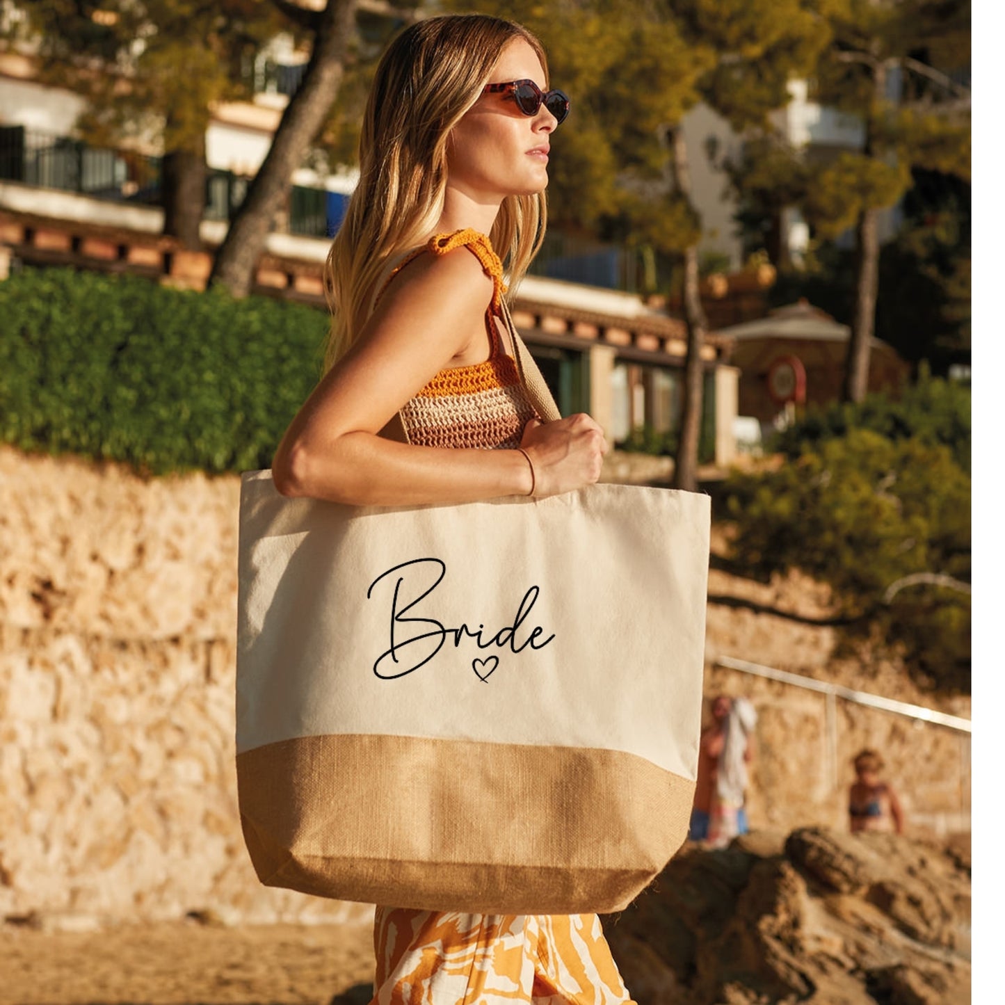 Model wearing large hessian bag with the text 'Bride'