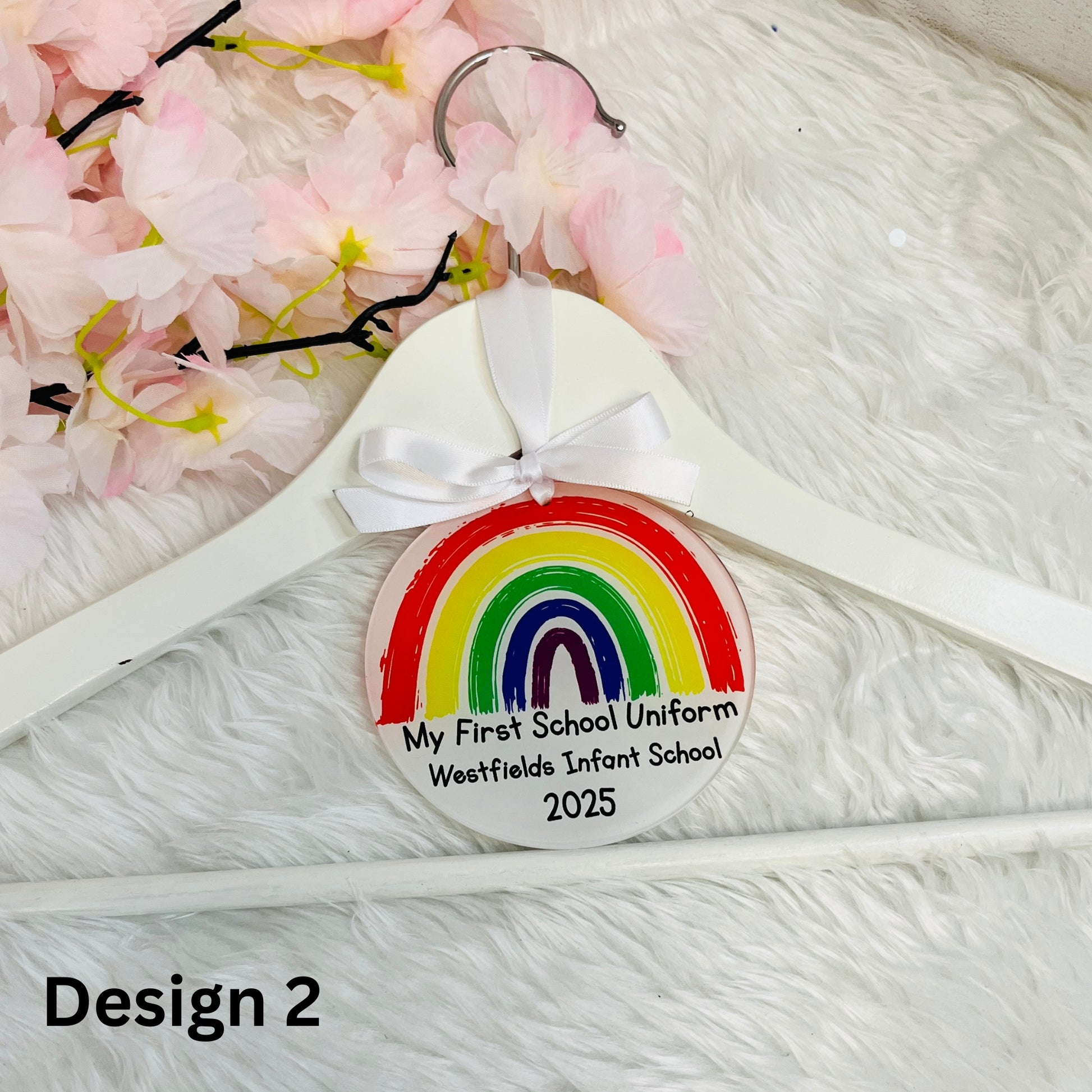Round Hanger Tag with 'my first school uniform' on a white wooden hanger