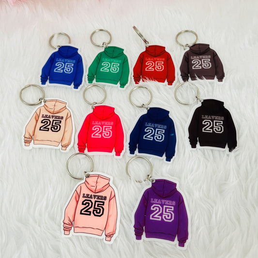 A collection of keyrings shaped like a hoodie with the text 'Leavers 25' on the back