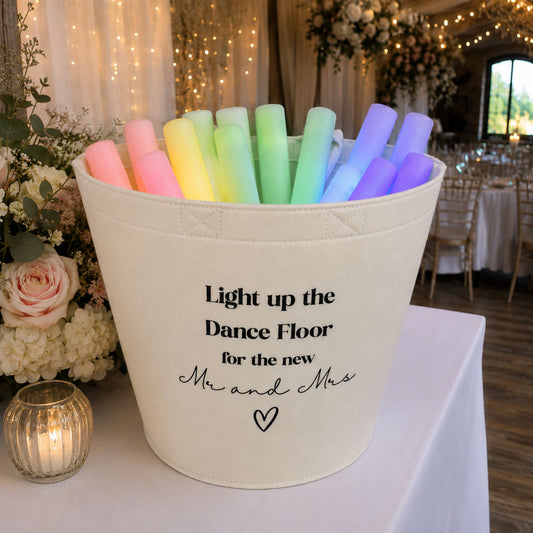 Off White Felt Trug with Glow sticks inside on a table at a wedding venue