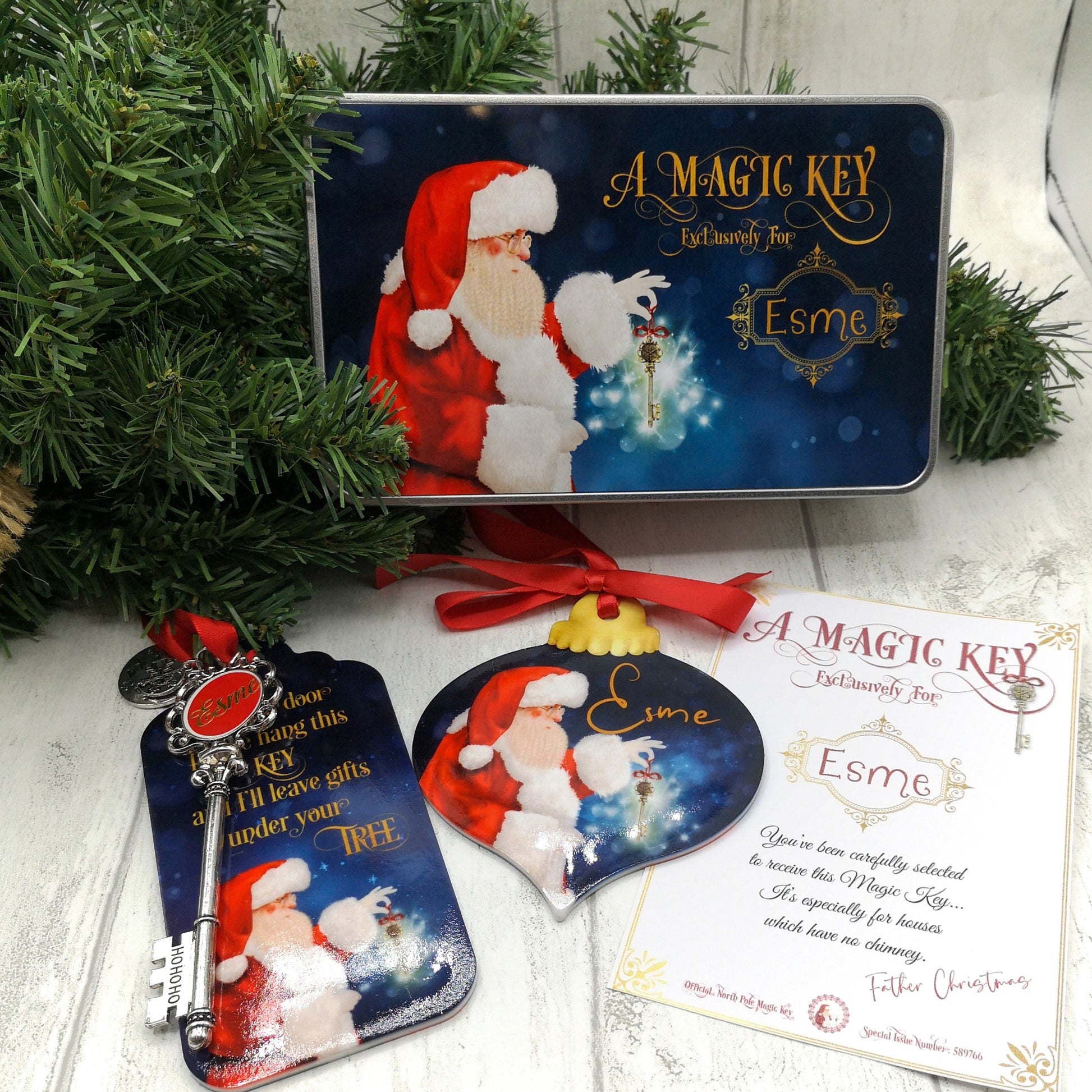 a collection of santas magical key featuring a tin, santa key and certificate along with a tree bauble personalised