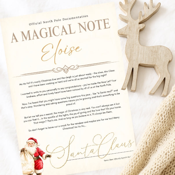Letter from Santa Claus with a wooden reindeer decoration on a white background