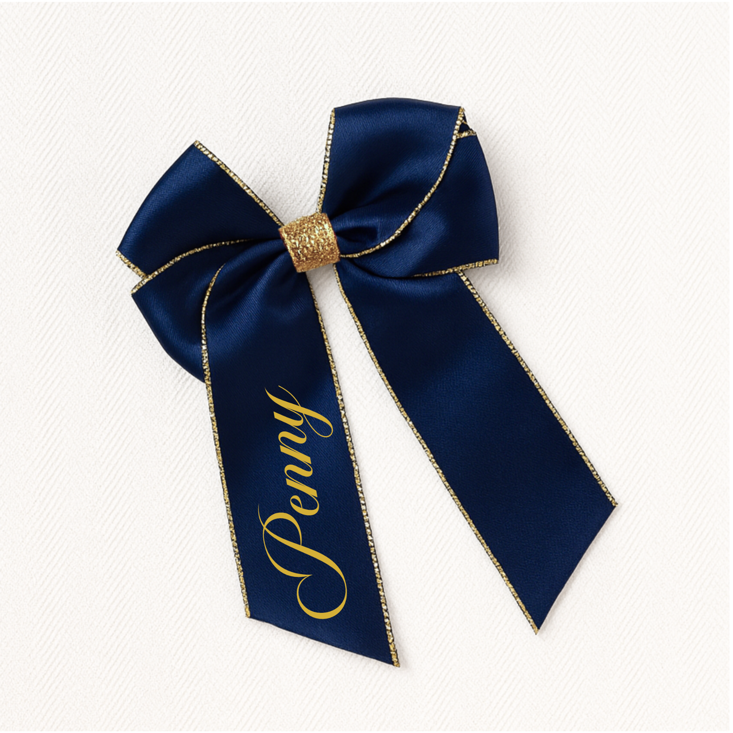 Large satin bow accessory with gold centre and custom gold vinyl name