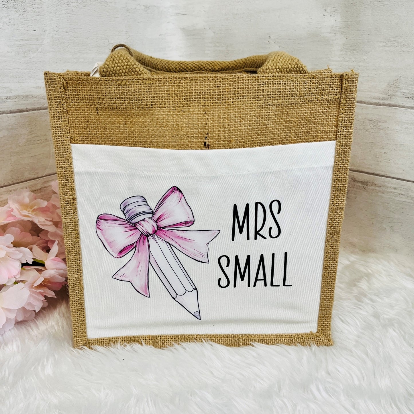 Jute bag with a pink bow and 'Mrs Small' text on a white background