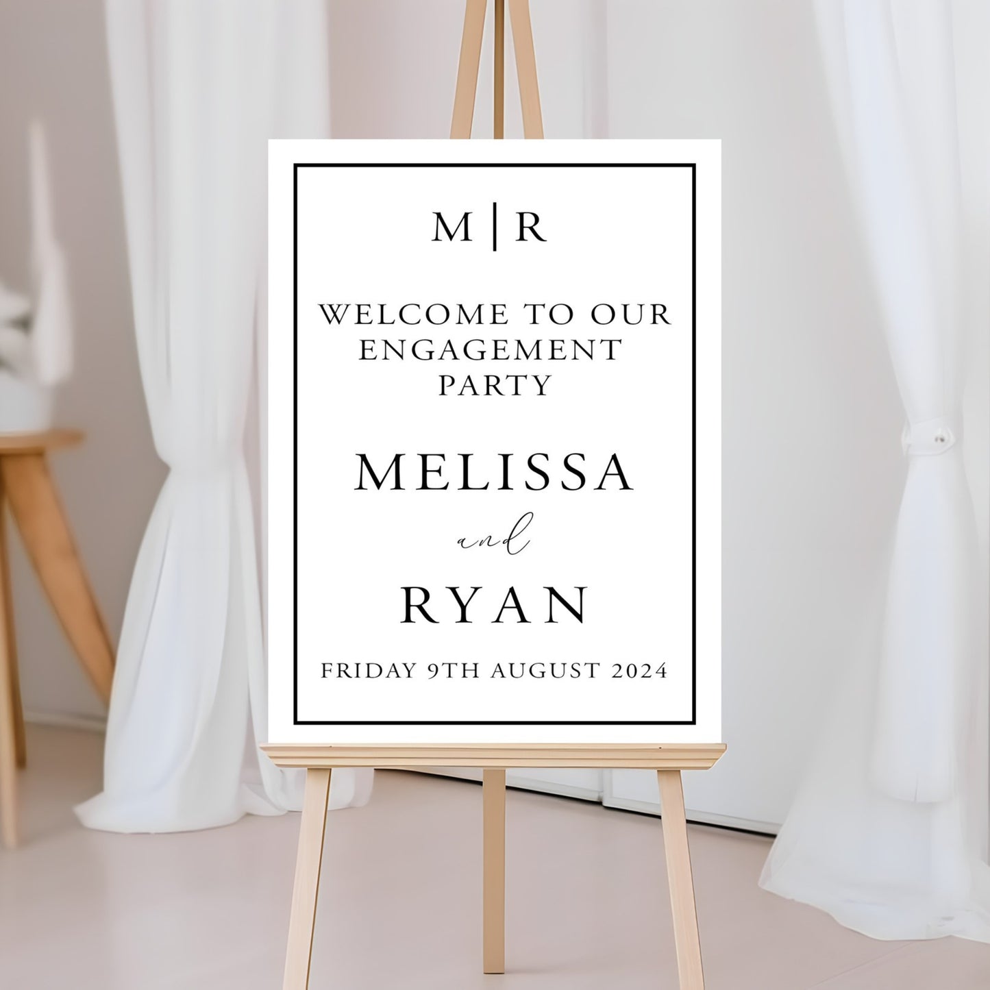 Engagement party A2 Printed Board on a stand with decorative elements.