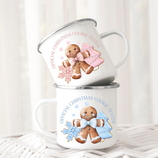 Two mugs with gingerbread men designs and text on a white background